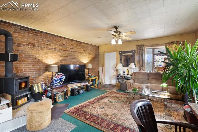 a living room with fireplace furniture and a fireplace