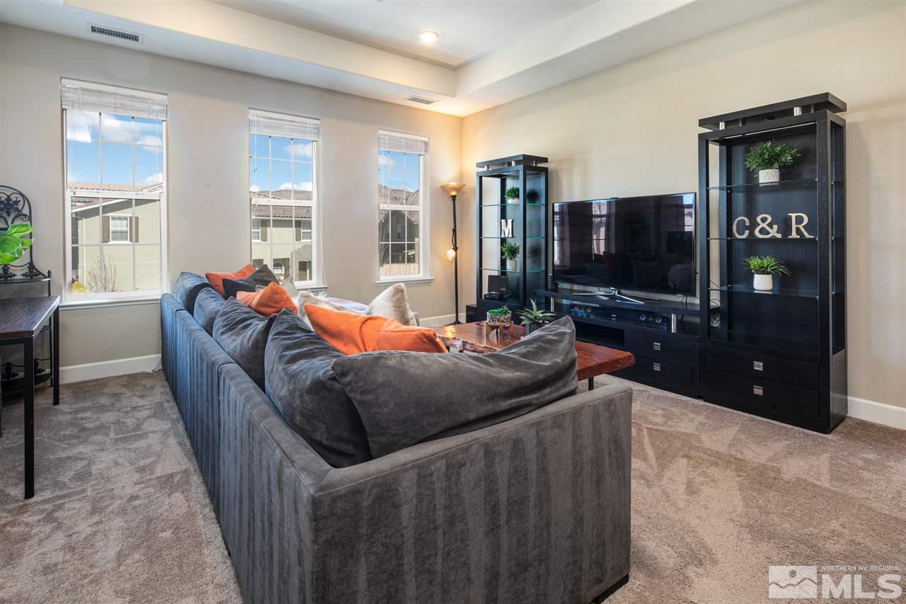 2032 Wind Ranch Road, Unit A Reno, NV 89521 - Photo 3 of 24 a living room with furniture and flat screen tv