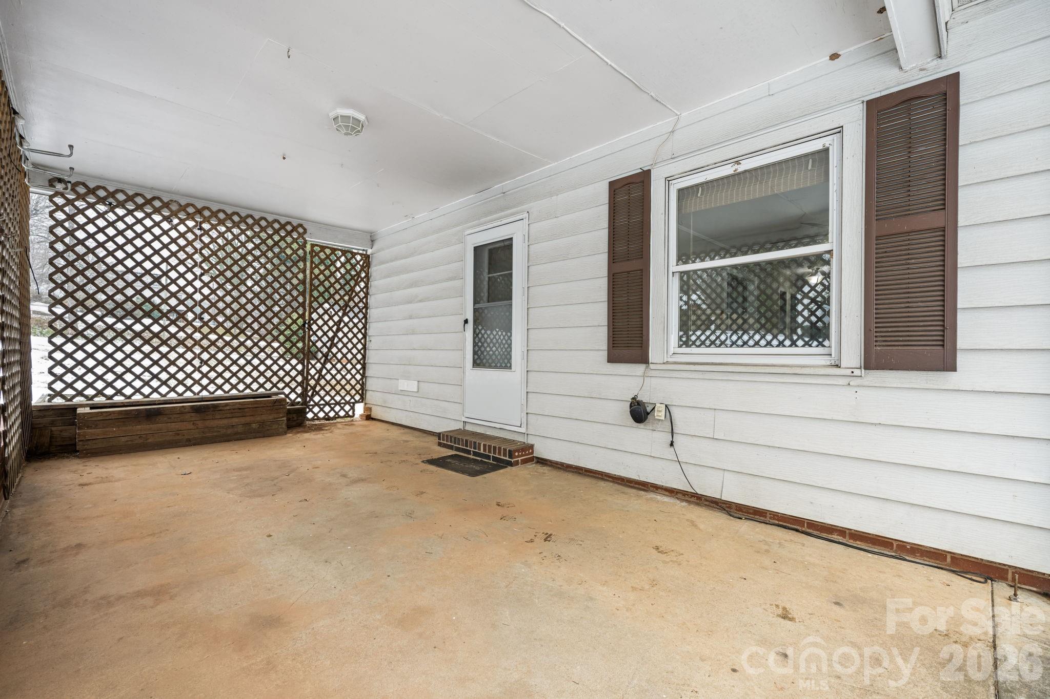 203 3rd Avenue Northeast Conover, NC 28613 - Photo 16 of 30 a view of an empty room with wooden floor and a window