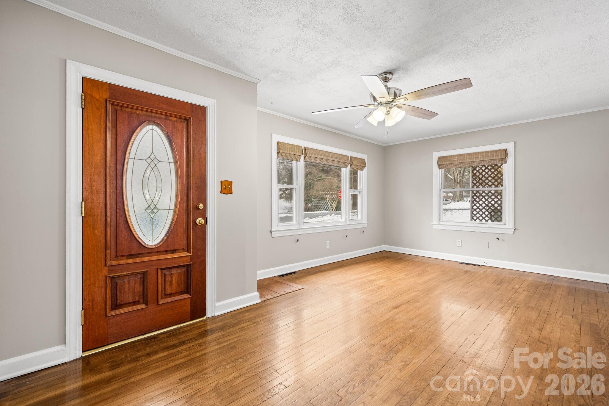 203 3rd Avenue Northeast Conover, NC 28613 - Photo 17 of 30 a view of an empty room with a window and wooden floor