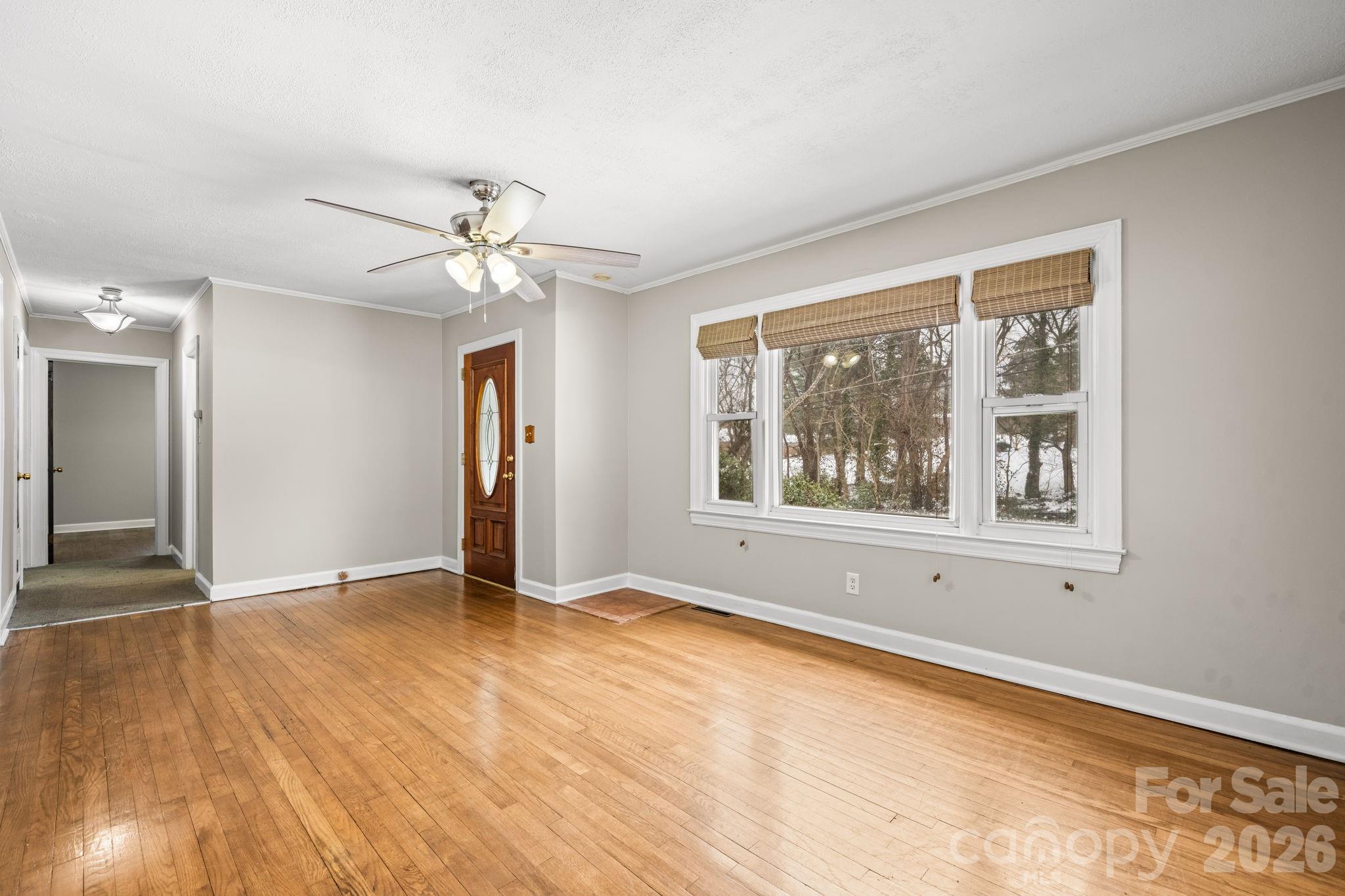203 3rd Avenue Northeast Conover, NC 28613 - Photo 18 of 30 wooden floor in an empty room with a window