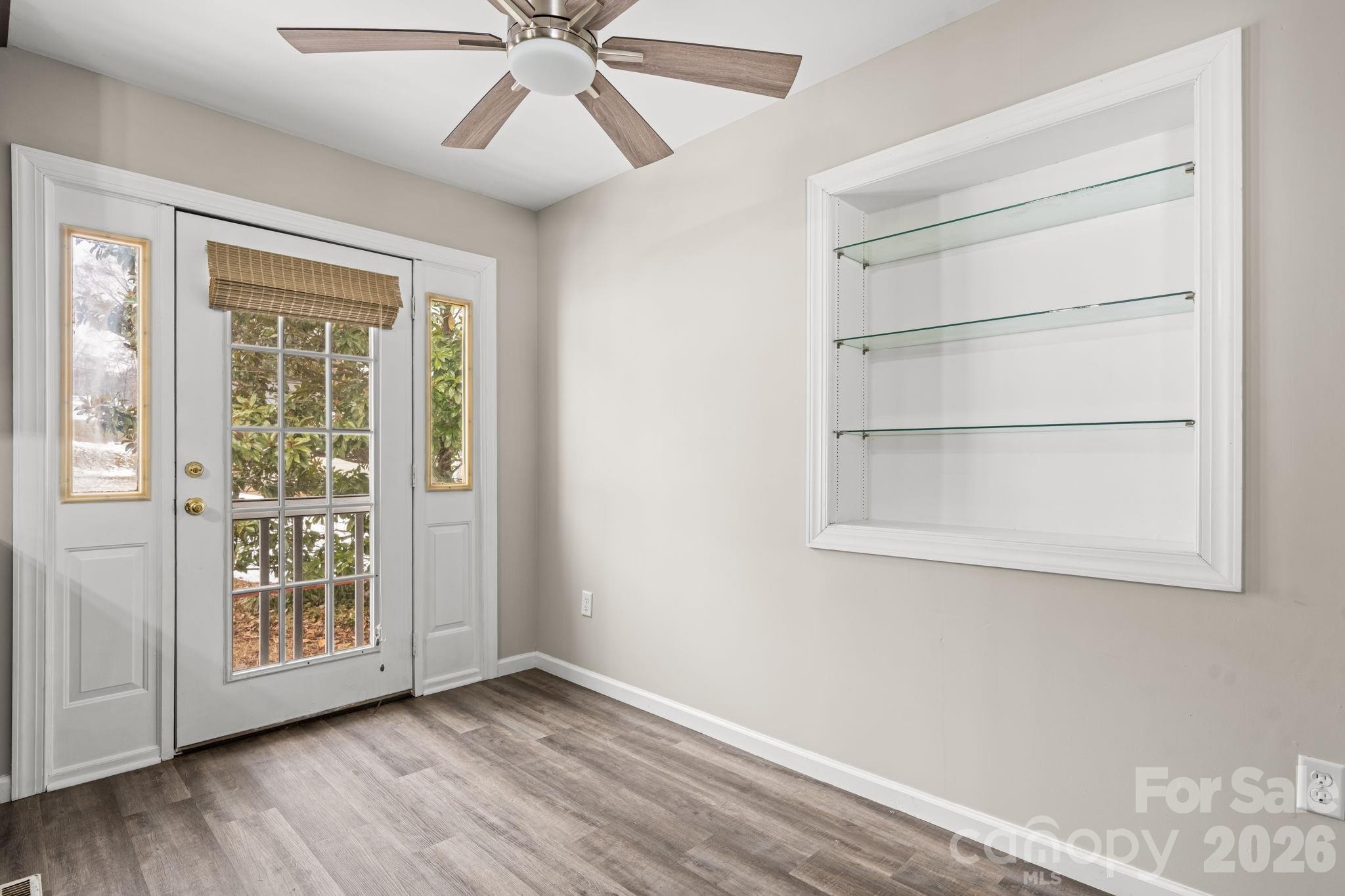 203 3rd Avenue Northeast Conover, NC 28613 - Photo 23 of 30 a view of an empty room with a window and wooden floor