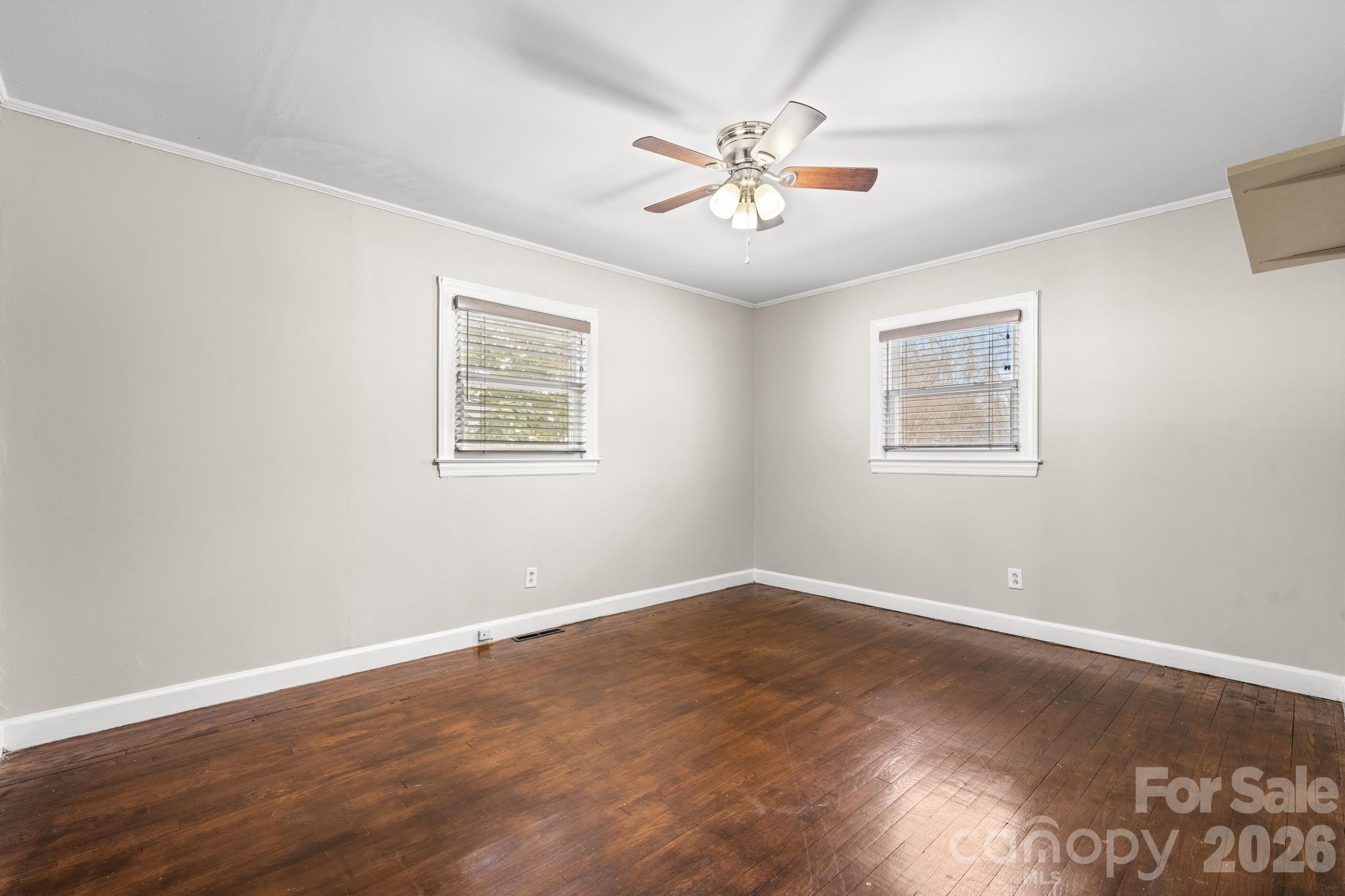 203 3rd Avenue Northeast Conover, NC 28613 - Photo 25 of 30 a view of a big room with wooden floor and windows