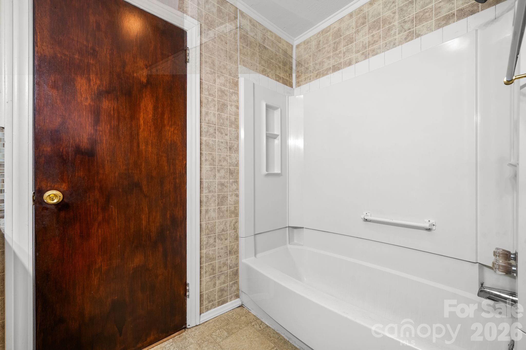 203 3rd Avenue Northeast Conover, NC 28613 - Photo 28 of 30 a bathroom with a bathtub and shower
