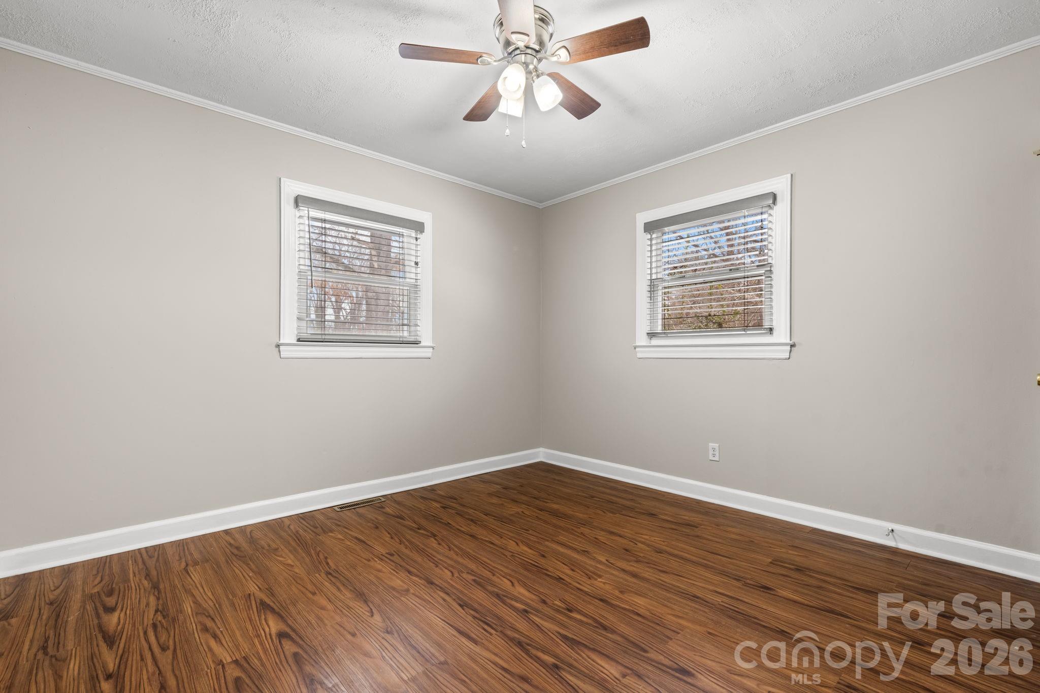 203 3rd Avenue Northeast Conover, NC 28613 - Photo 29 of 30 a view of an empty room with wooden floor and a window