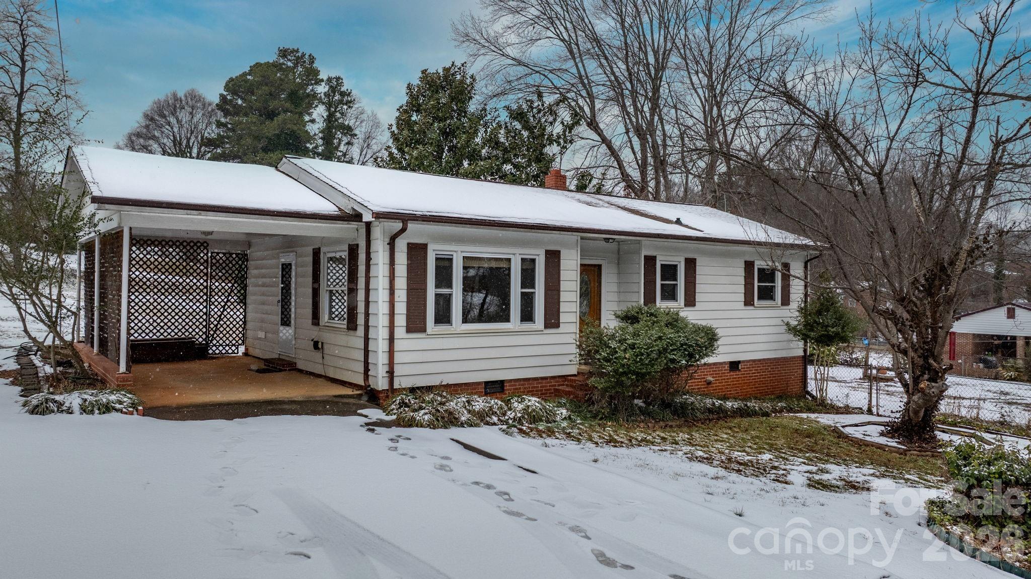203 3rd Avenue Northeast Conover, NC 28613 - Photo 3 of 30 a front view of a house with garden
