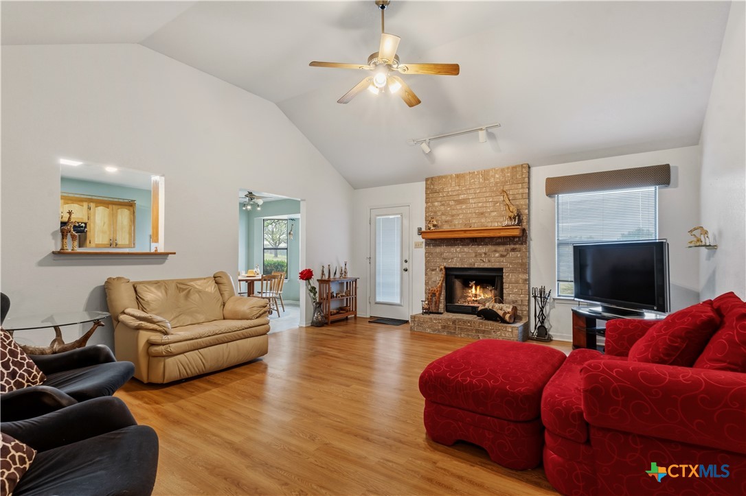 261 County Road 4963 Kempner, TX 76539 - Photo 11 of 44 a living room with furniture fireplace and a flat screen tv