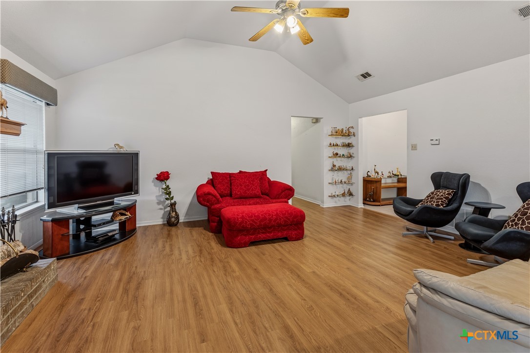 261 County Road 4963 Kempner, TX 76539 - Photo 13 of 44 a living room with furniture and a flat screen tv