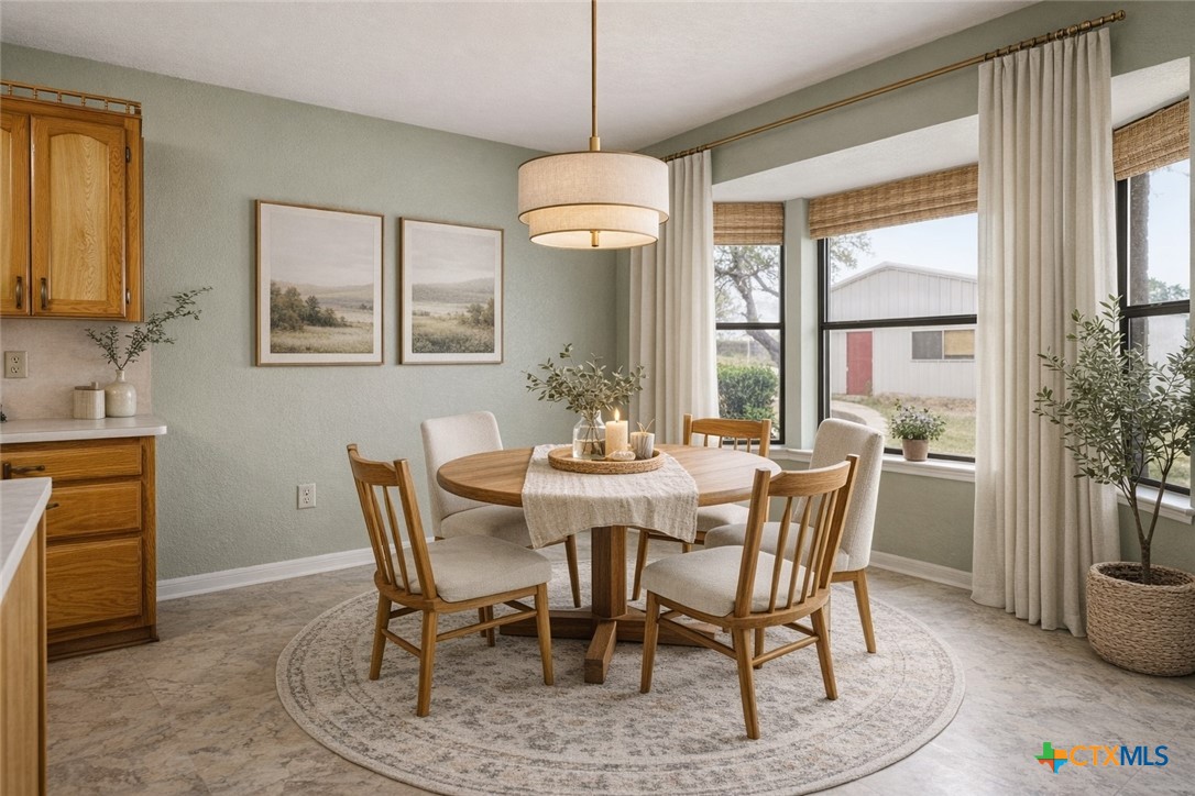 261 County Road 4963 Kempner, TX 76539 - Photo 14 of 44 a dining room with furniture a chandelier and wooden floor