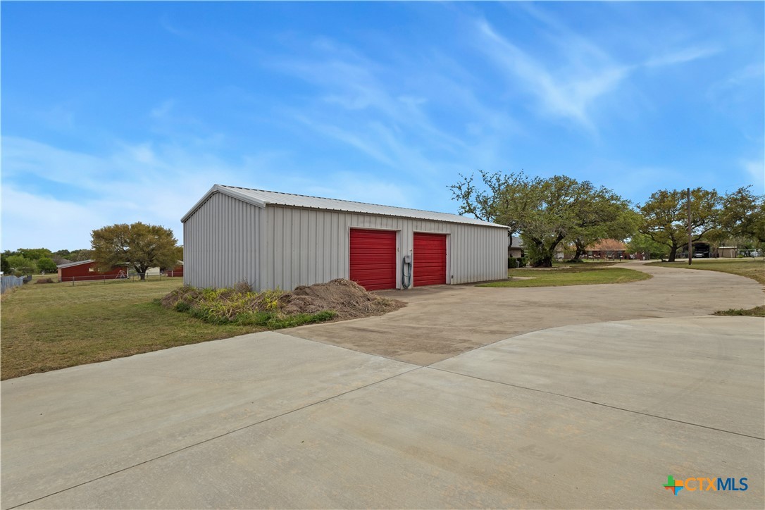 261 County Road 4963 Kempner, TX 76539 - Photo 2 of 44 a view of a house with a yard and garage
