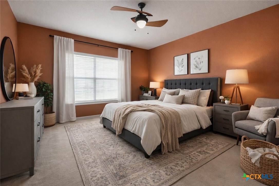 261 County Road 4963 Kempner, TX 76539 - Photo 22 of 44 a spacious bedroom with a bed a couch and a flat tv screen on dresser