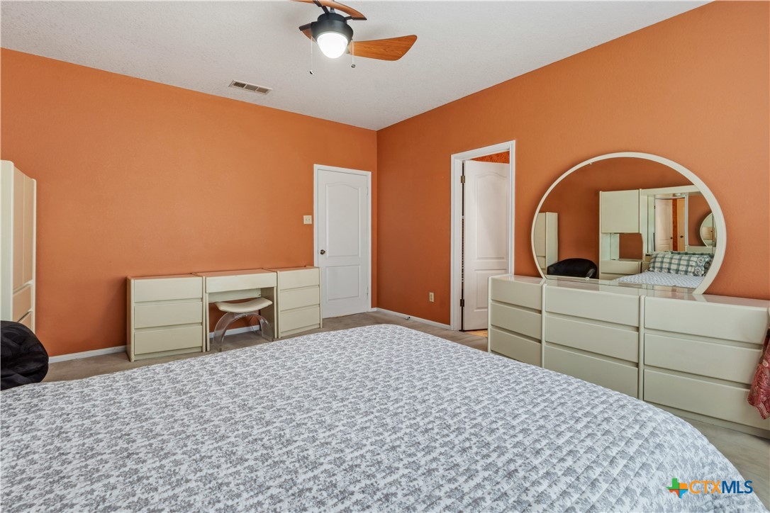 261 County Road 4963 Kempner, TX 76539 - Photo 25 of 44 a bedroom with a bed and a dresser