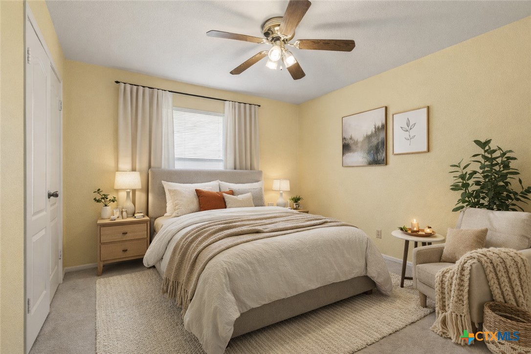 261 County Road 4963 Kempner, TX 76539 - Photo 31 of 44 a bedroom with bed and a chandelier