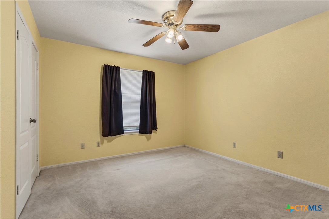 261 County Road 4963 Kempner, TX 76539 - Photo 32 of 44 an empty room with windows and fan