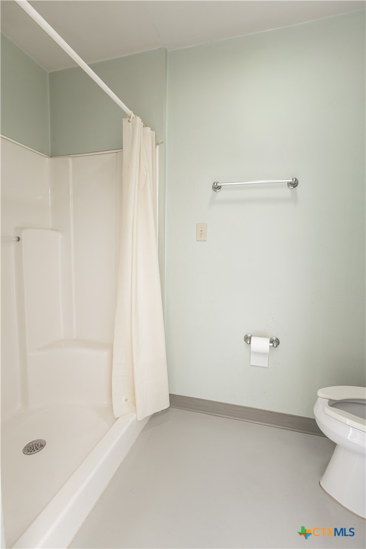 261 County Road 4963 Kempner, TX 76539 - Photo 38 of 44 a bathroom with a shower and a toilet