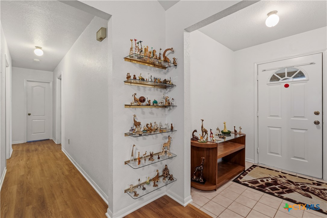 261 County Road 4963 Kempner, TX 76539 - Photo 9 of 44 a hallway with toys and wooden floor
