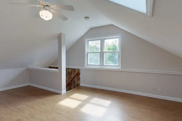 a view of room with window and hardwood floor