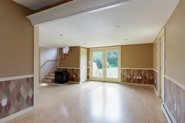 a view of an empty room with a window