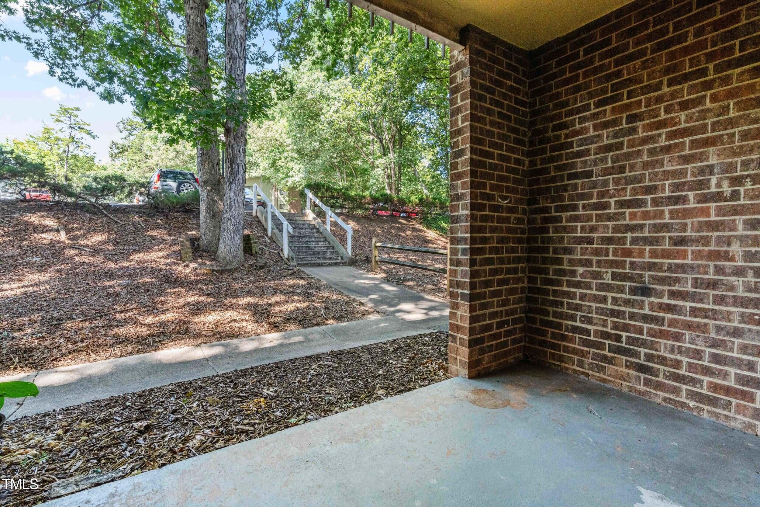 1212 Schaub Drive, Unit C Raleigh, NC 27606 - Photo 9 of 23 a backyard of a house