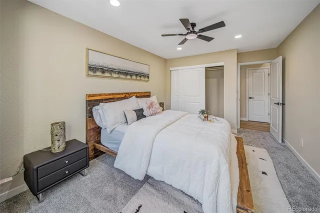 a bedroom with bed and window