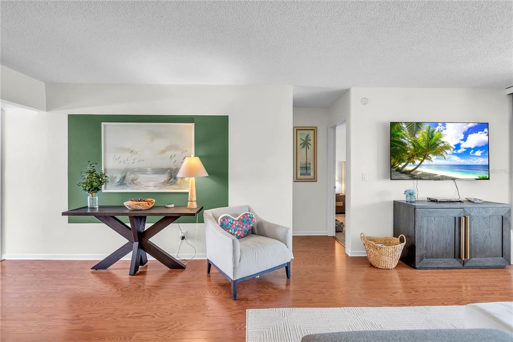 12200 Vonn Road, Unit 2206 Largo, FL 33774 - Photo 14 of 60 a living room with furniture and a flat screen tv