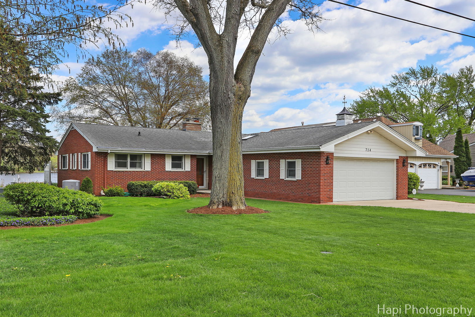 714 South Riverside Drive McHenry, IL 60050 - Photo 11 of 49 a front view of a house with yard and green space
