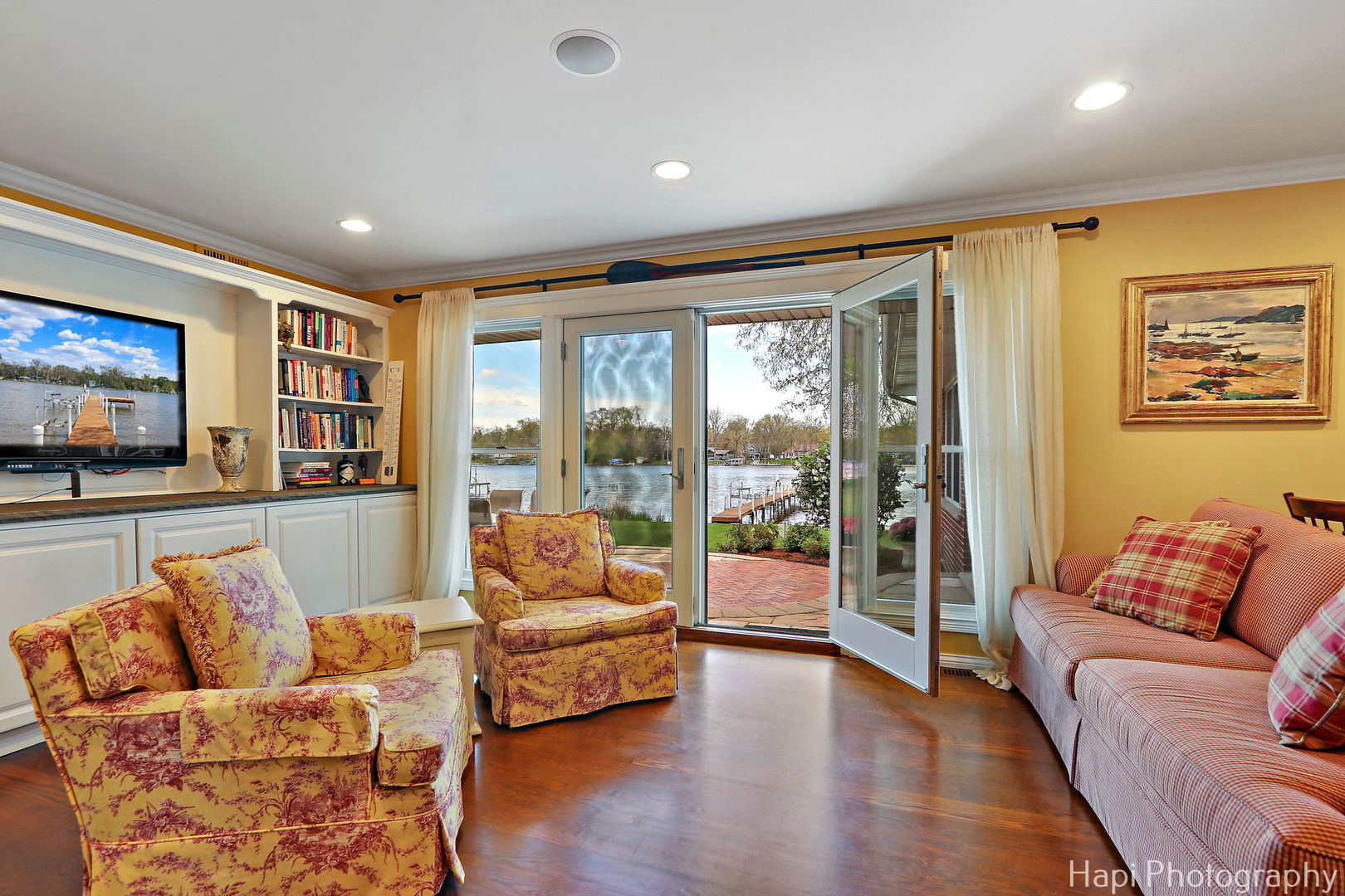 714 South Riverside Drive McHenry, IL 60050 - Photo 13 of 49 a living room with furniture and a flat screen tv