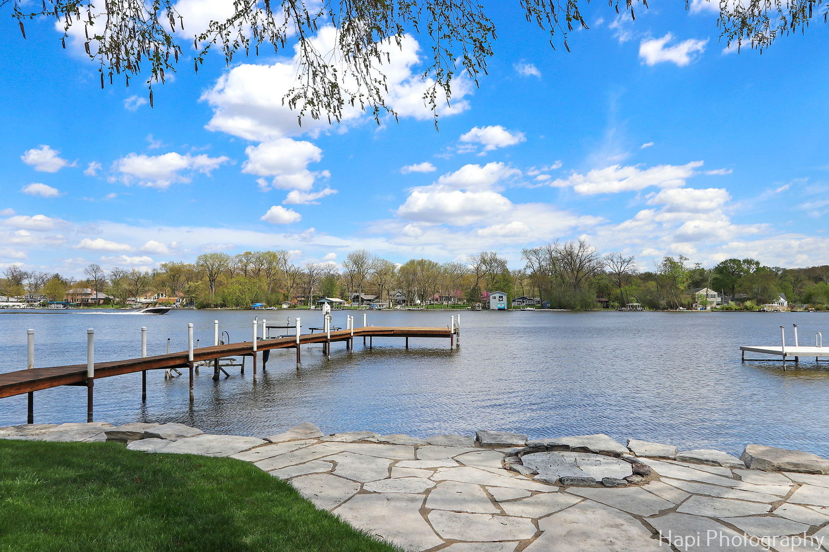 714 South Riverside Drive McHenry, IL 60050 - Photo 2 of 49 a view of a lake with houses in the back