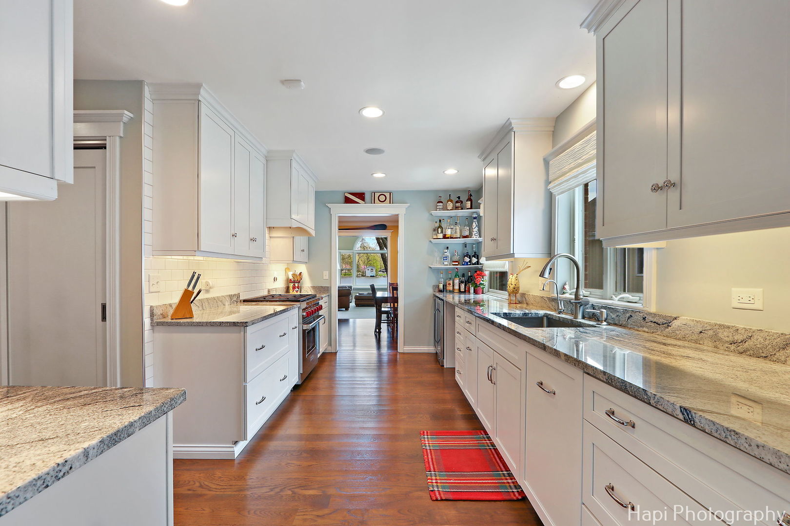 714 South Riverside Drive McHenry, IL 60050 - Photo 23 of 49 a large kitchen with stainless steel appliances granite countertop a lot of counter space and wooden floor