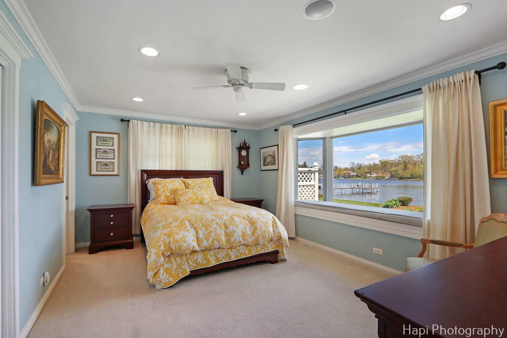 714 South Riverside Drive McHenry, IL 60050 - Photo 28 of 49 a bedroom with a large bed and a large window