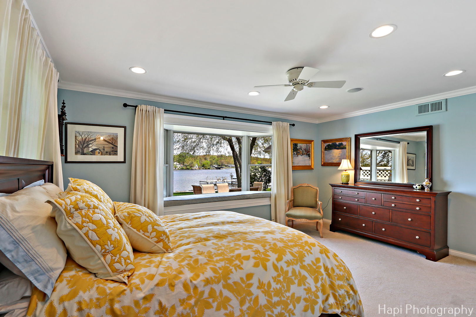 714 South Riverside Drive McHenry, IL 60050 - Photo 29 of 49 a bedroom with a bed and wooden floor