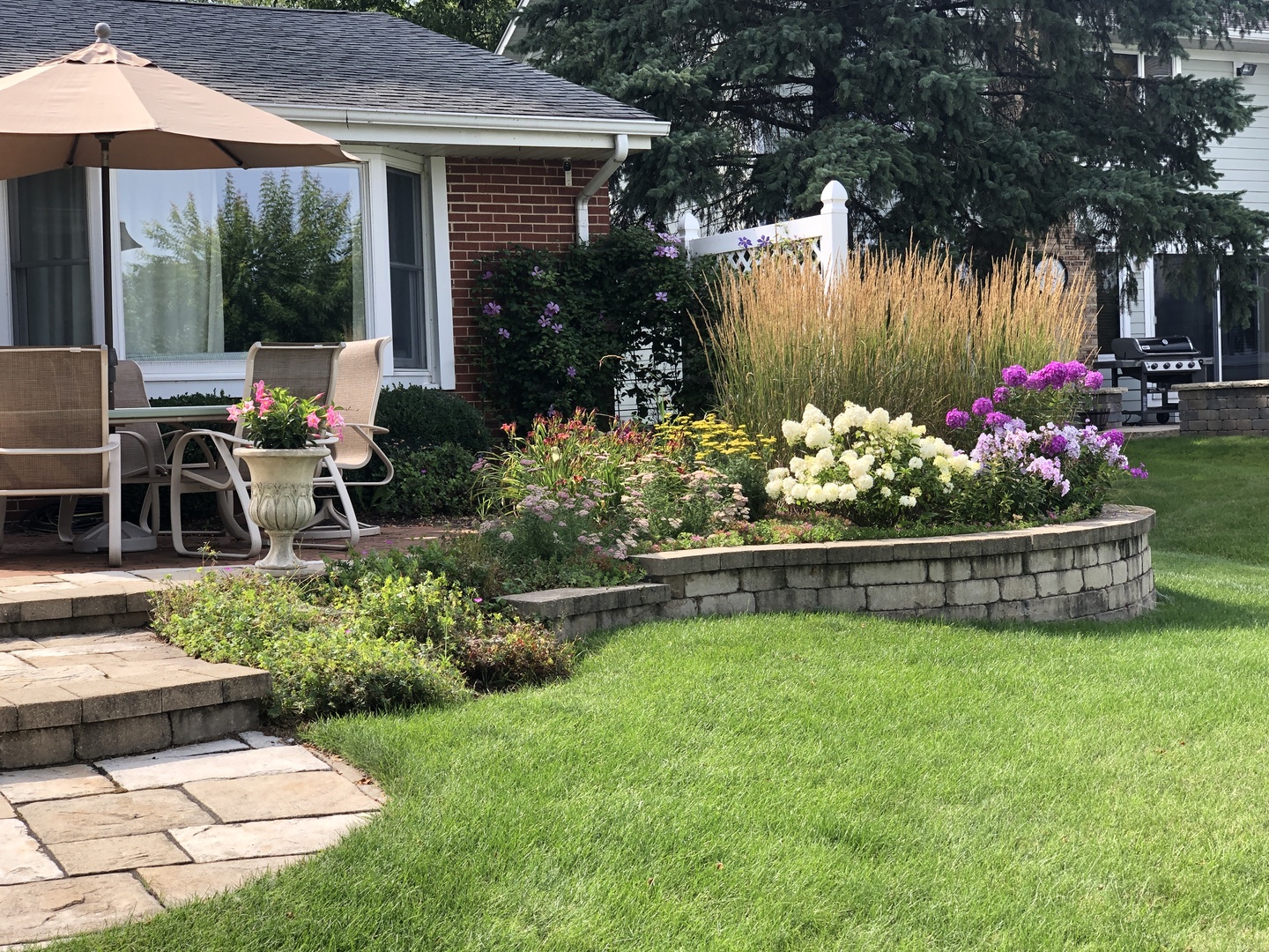 714 South Riverside Drive McHenry, IL 60050 - Photo 40 of 49 a view of a house with backyard sitting area and garden