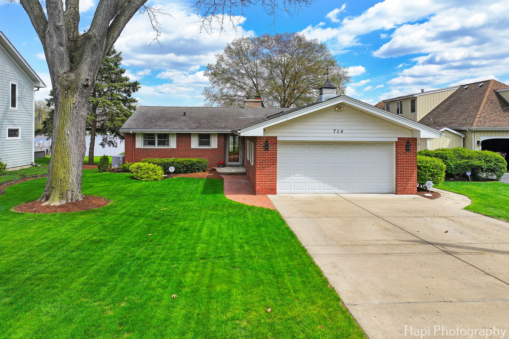 714 South Riverside Drive McHenry, IL 60050 - Photo 44 of 49 a front view of a house with a yard and garage