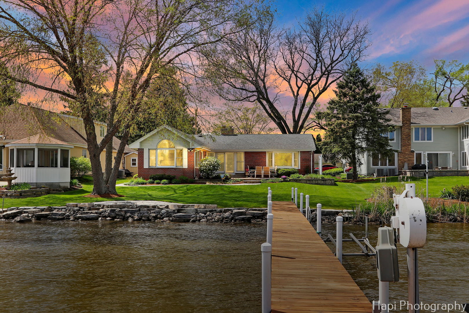 714 South Riverside Drive McHenry, IL 60050 - Photo 48 of 49 a front view of a house with a yard table and chairs