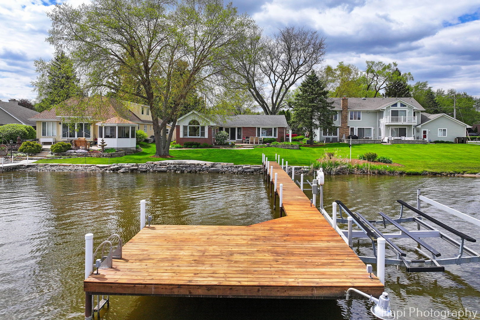 714 South Riverside Drive McHenry, IL 60050 - Photo 6 of 49 a view of house next to a lake with a large trees