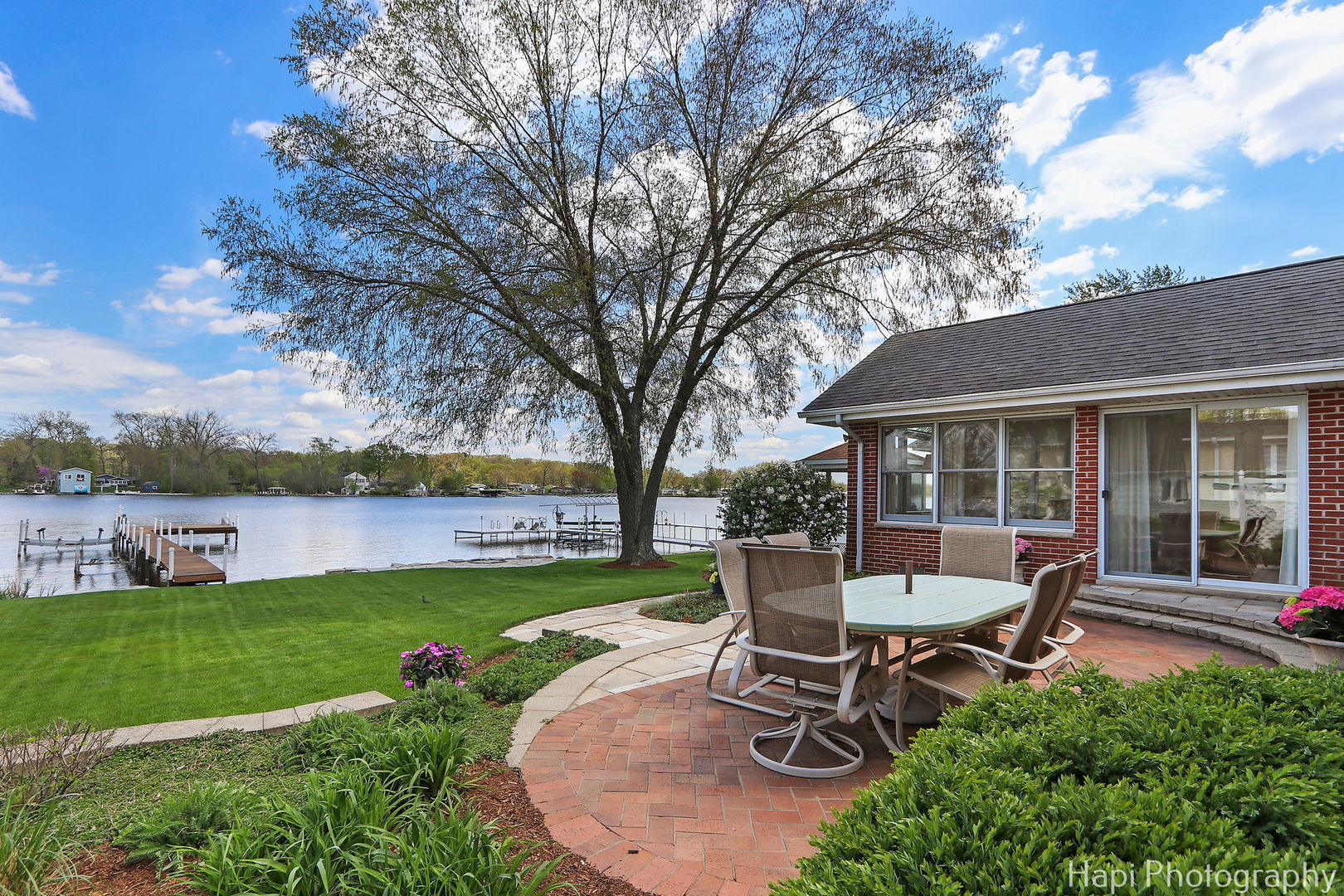 714 South Riverside Drive McHenry, IL 60050 - Photo 10 of 49 a view of a house with backyard sitting area and garden