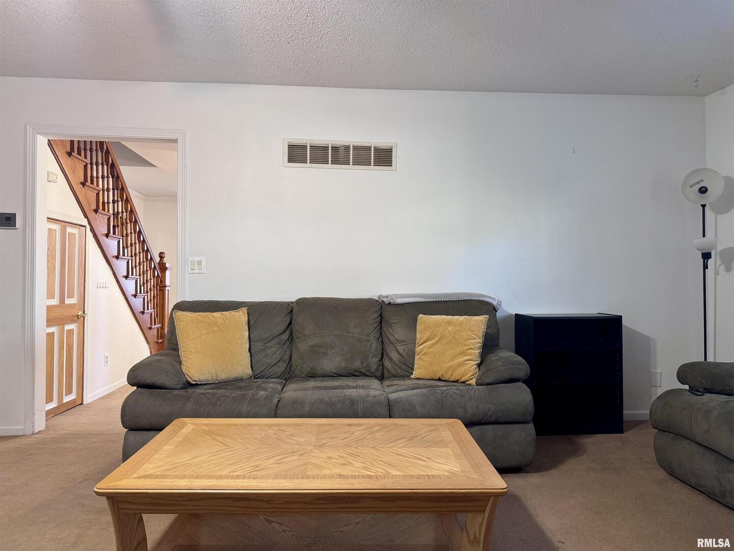 2711 North 2nd Street Clinton, IA 52732 - Photo 9 of 24 a living room with furniture and a night stand