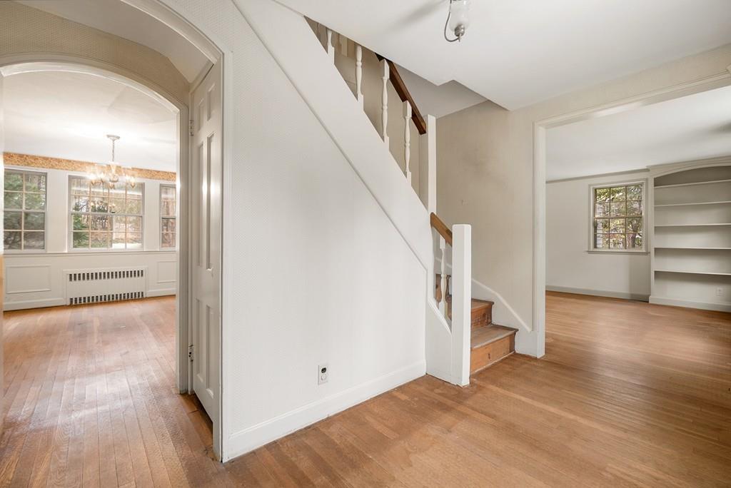 28 Montvale Road Weston, MA 02493 - Photo 18 of 26 a view of a livingroom with wooden floor and stairs