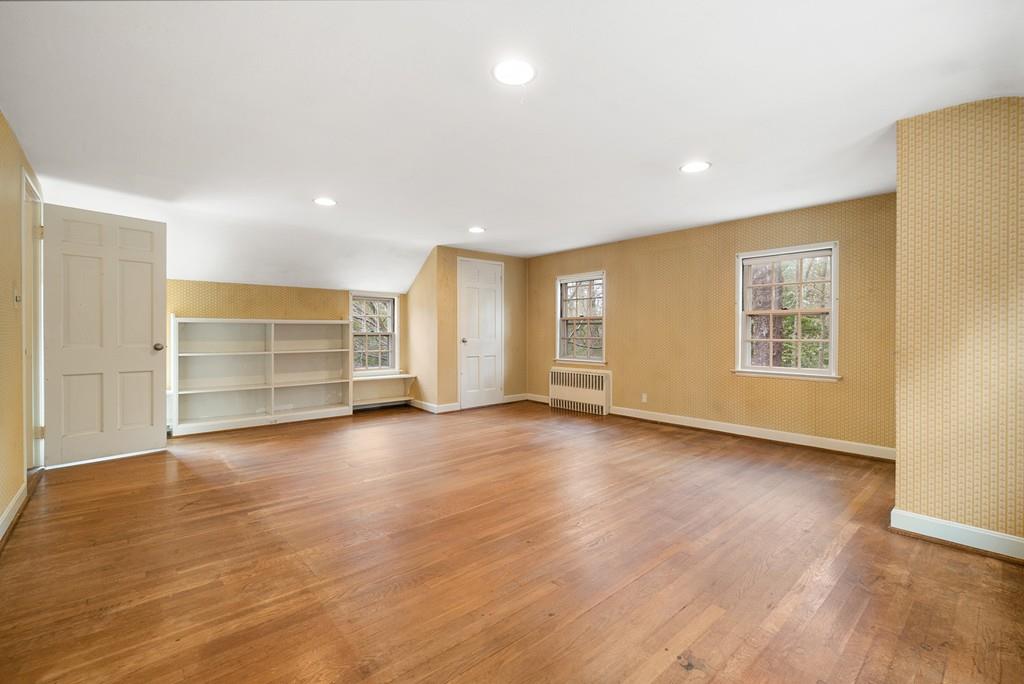 28 Montvale Road Weston, MA 02493 - Photo 22 of 26 an empty room with wooden floor closet and windows