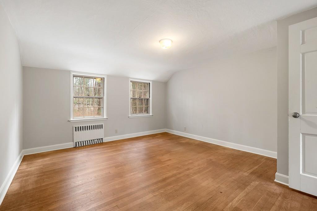 28 Montvale Road Weston, MA 02493 - Photo 23 of 26 an empty room with wooden floor and windows