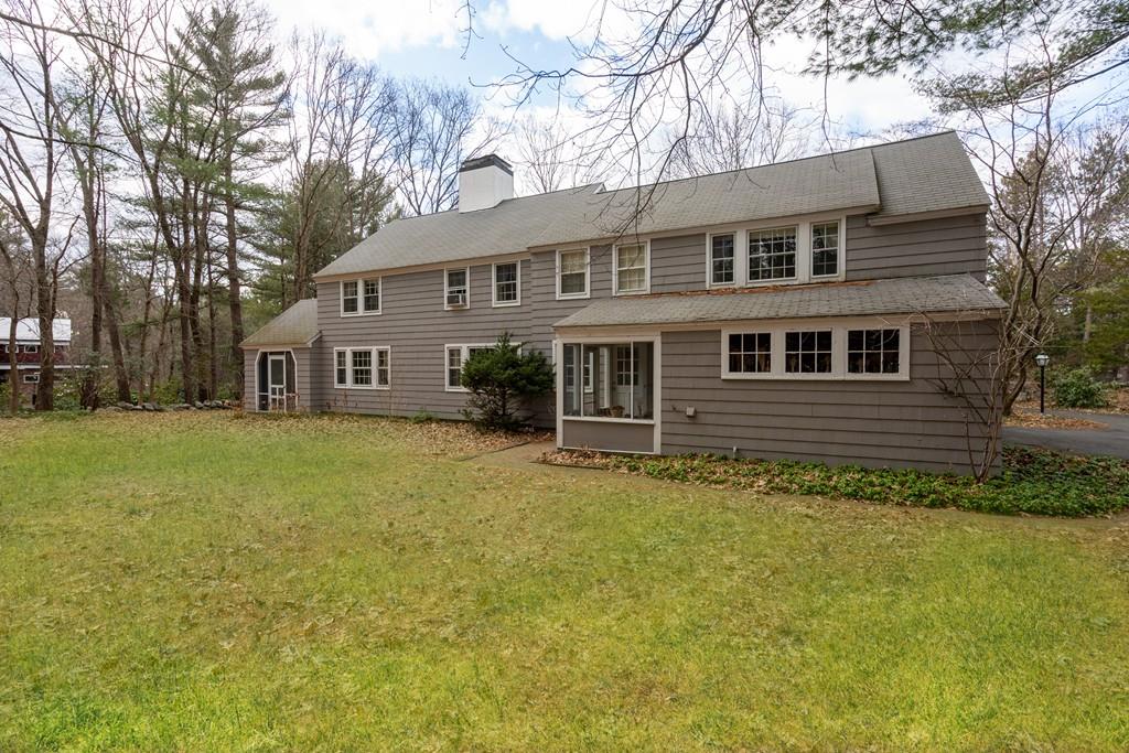 28 Montvale Road Weston, MA 02493 - Photo 6 of 26 a front view of a house with a garden