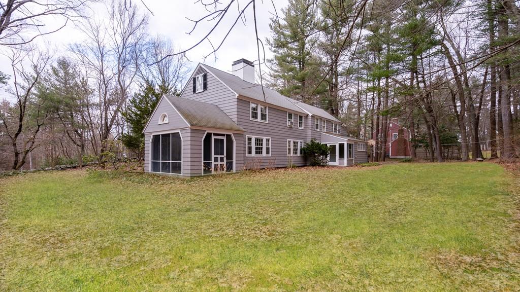 28 Montvale Road Weston, MA 02493 - Photo 9 of 26 a front view of a house with a garden