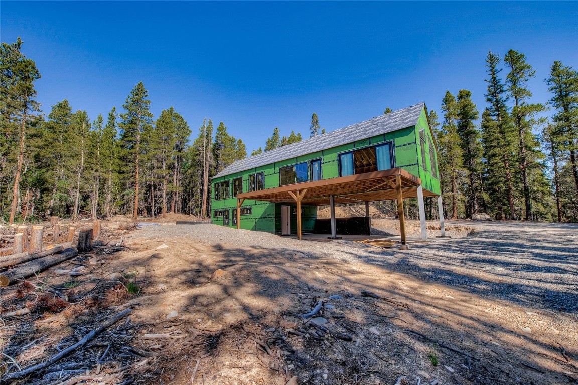 472 Vots Drive Fairplay, CO 80440 - Photo 12 of 40 a view of a house with large trees and a big yard