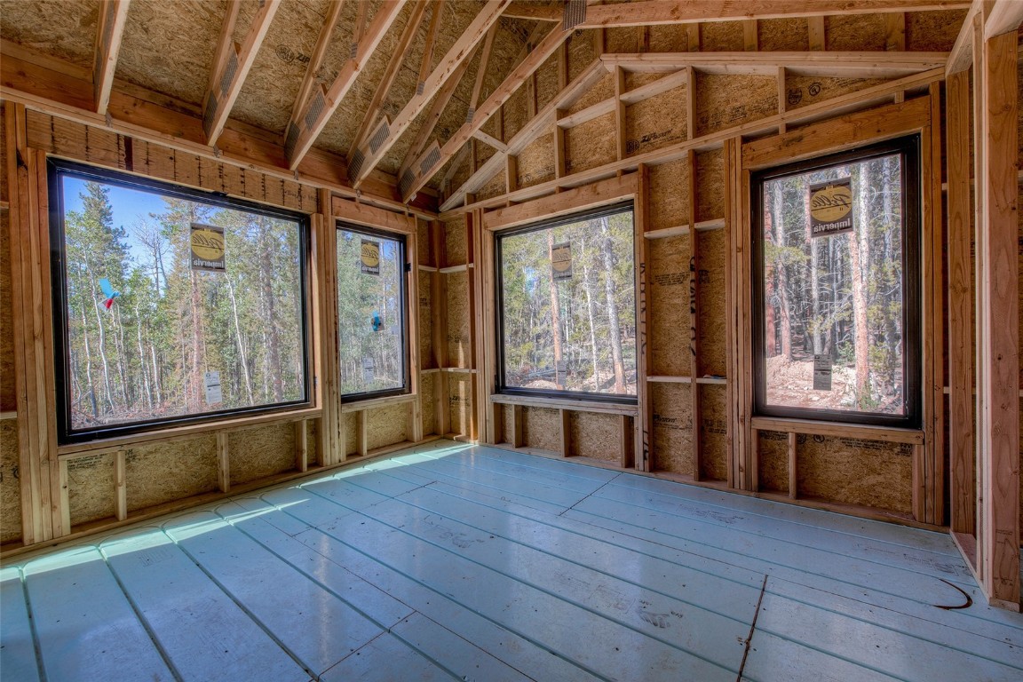472 Vots Drive Fairplay, CO 80440 - Photo 16 of 40 a view of an empty room with a window and wooden floor