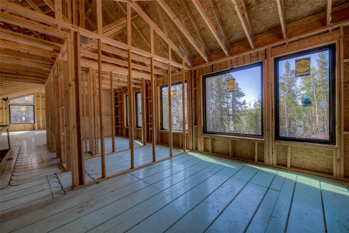 472 Vots Drive Fairplay, CO 80440 - Photo 17 of 40 a view of an empty room with wooden floor and a window