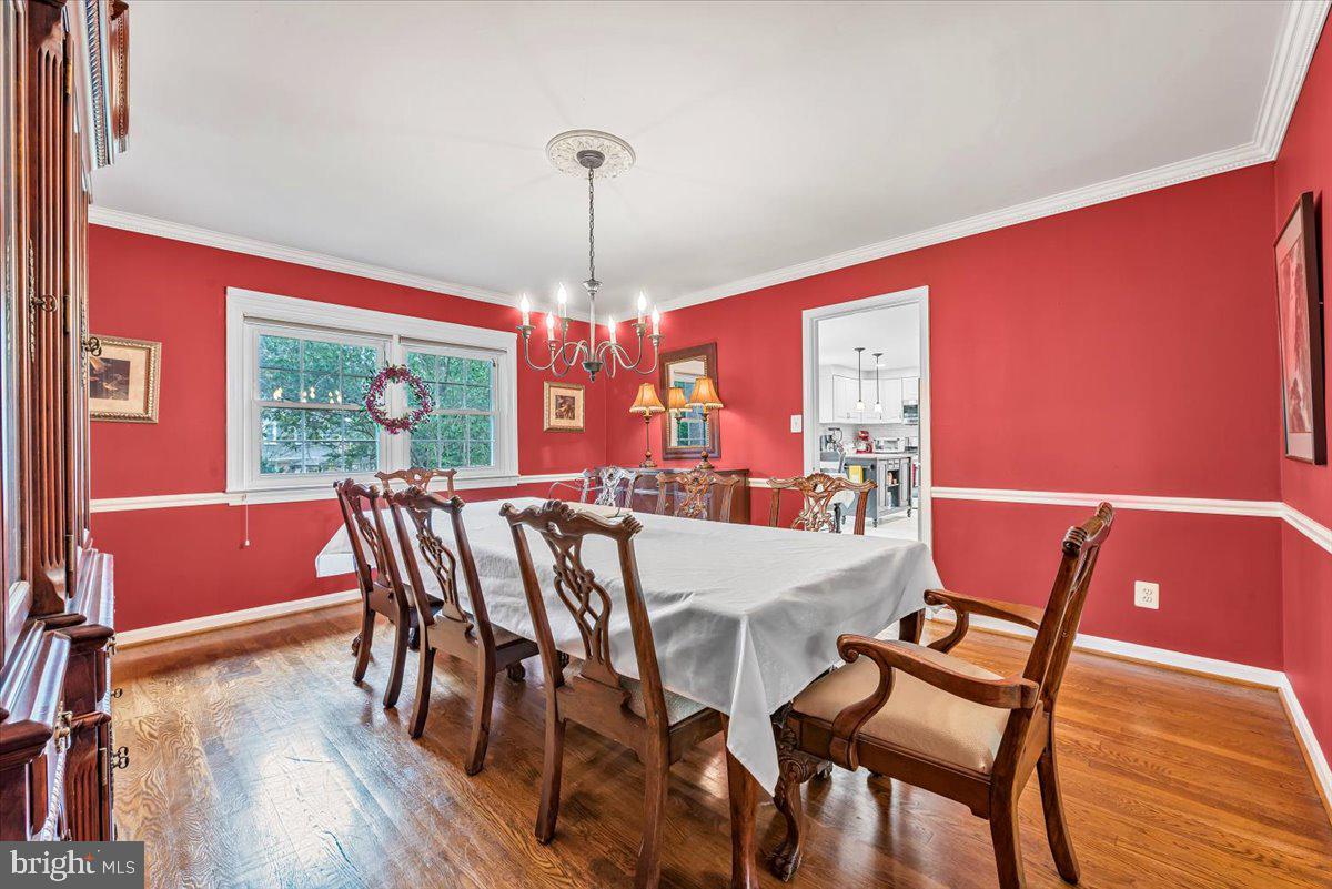 9809 Canal Road Gaithersburg, MD 20886 - Photo 12 of 50 a view of a dining room with furniture window and wooden floor