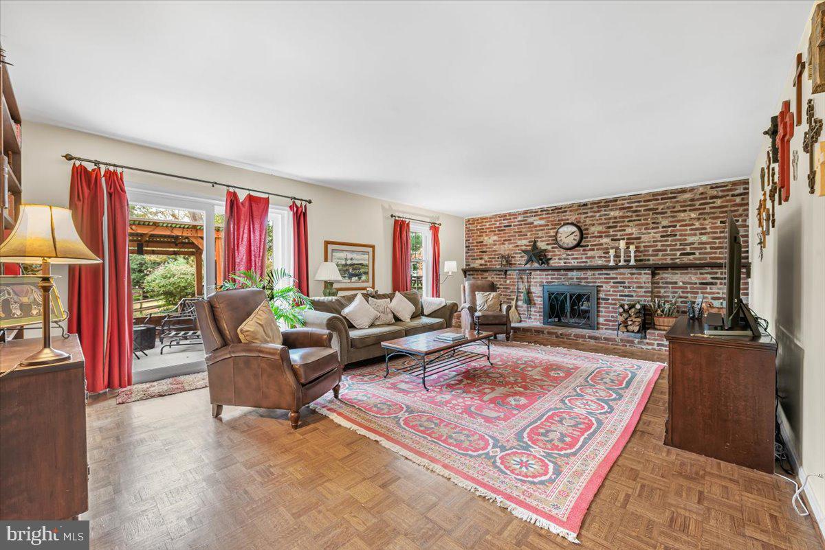 9809 Canal Road Gaithersburg, MD 20886 - Photo 17 of 50 a living room with furniture large window and a fireplace