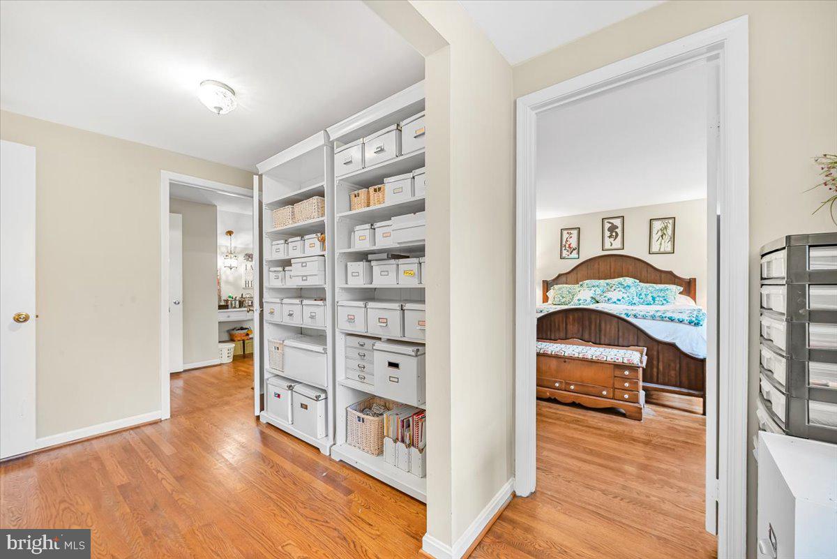 9809 Canal Road Gaithersburg, MD 20886 - Photo 23 of 50 a view of a bedroom with furniture and wooden floor