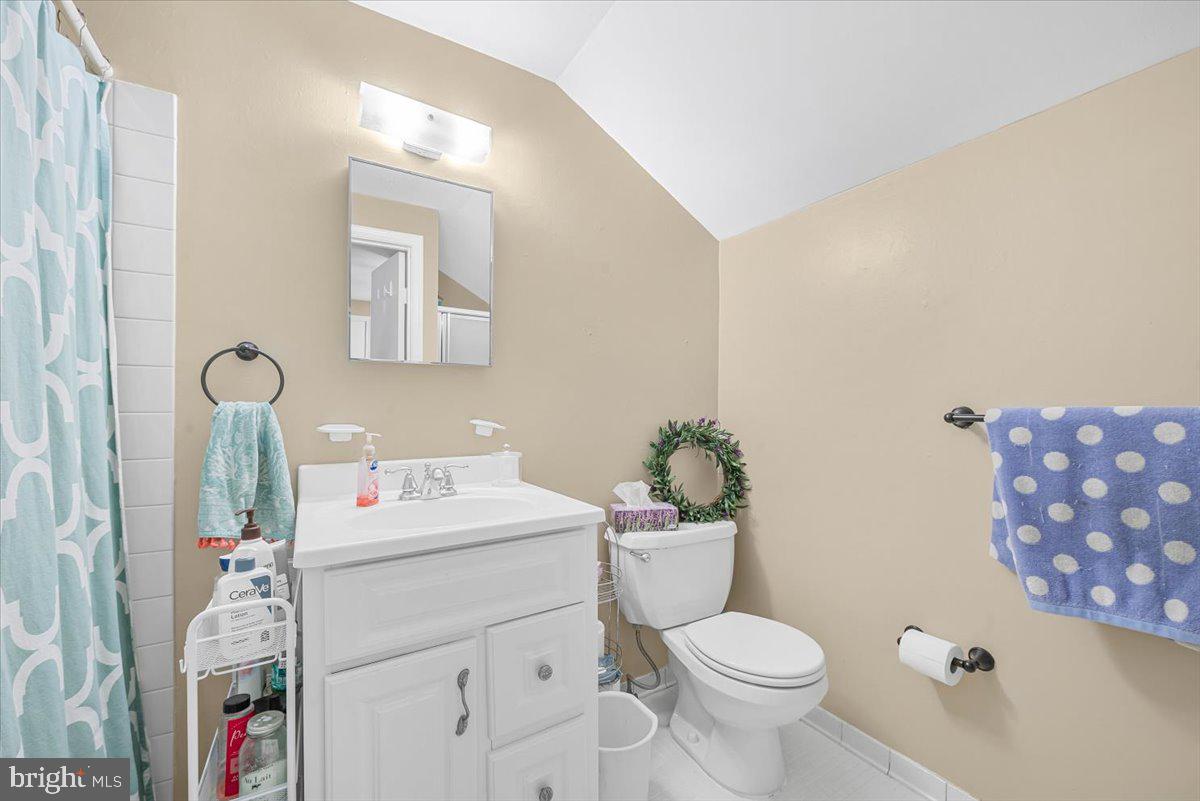 9809 Canal Road Gaithersburg, MD 20886 - Photo 31 of 50 a bathroom with a toilet sink and mirror