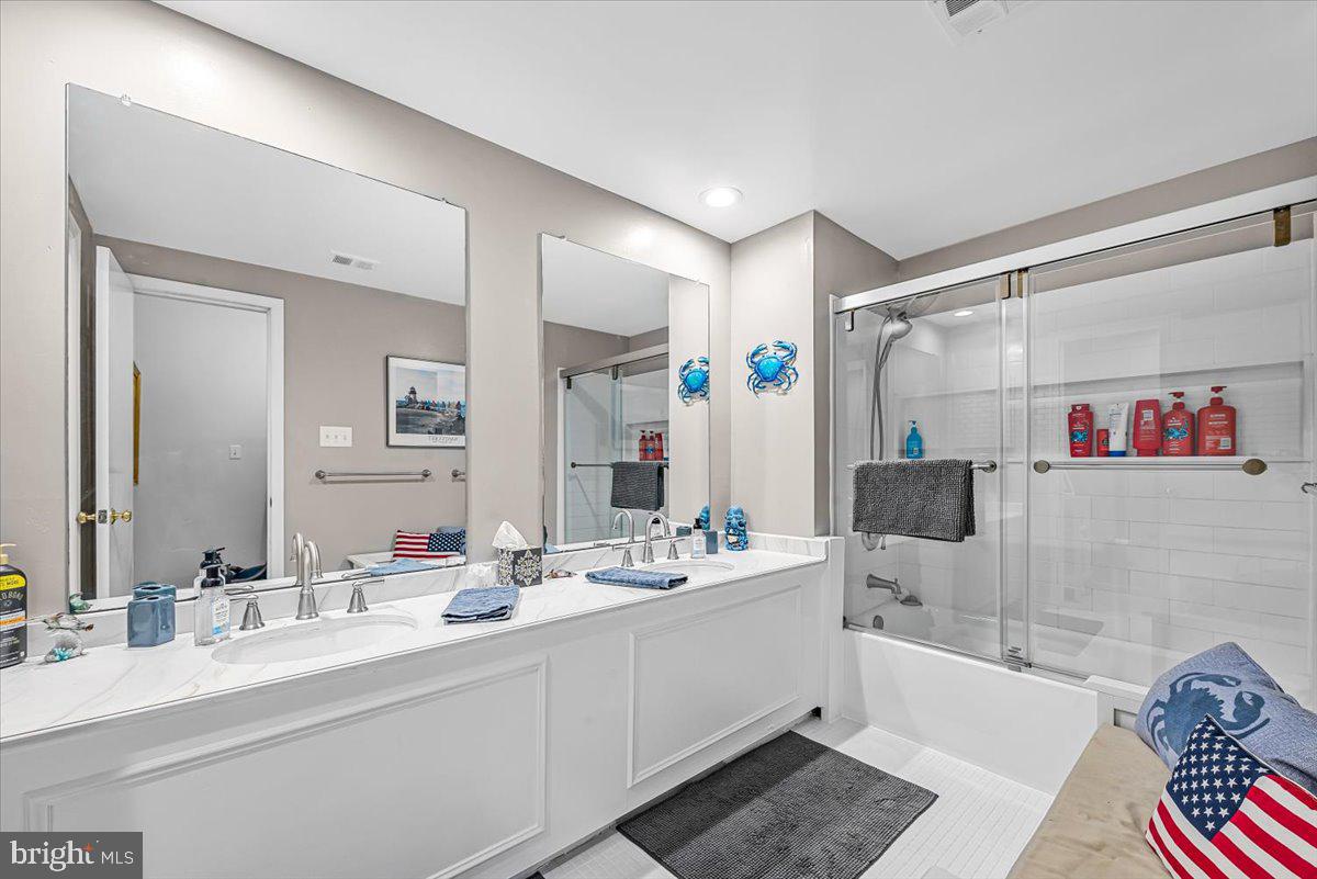 9809 Canal Road Gaithersburg, MD 20886 - Photo 35 of 50 a bathroom with a double vanity sink mirror and double